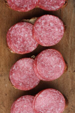 Sandwiches with bread and sausage on the tableの写真素材