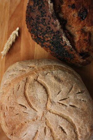 Fresh homemade bread on the table macroの写真素材