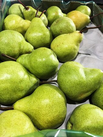 Fresh green pears on the market macroの写真素材