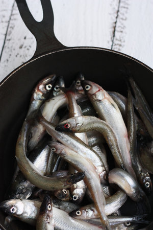 Fresh fish in the pan close up