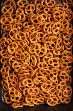 Delicious pretzels with salt on the table