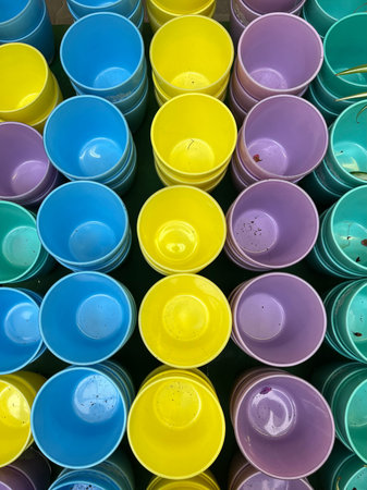 Colorful plastic pots for plant in a market, closeup of photoの写真素材