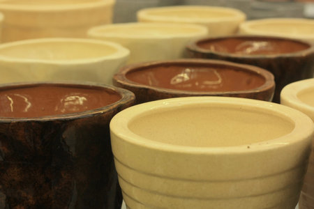 Clay pots with chocolate in a shop, closeup of photo