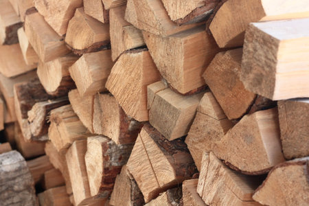 Firewood stacked in a pile for the winter, close-up