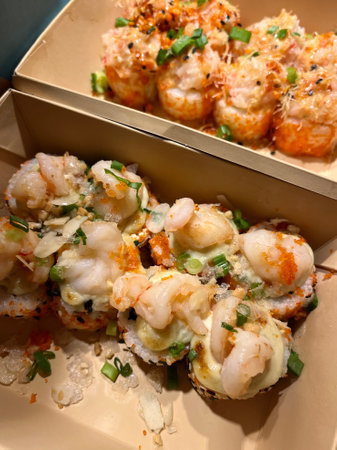 Seafood sushi rolls with shrimps, prawns and mussels in a boxの写真素材