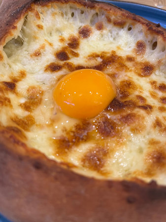 Egg yolk in a bread, close-up shot.