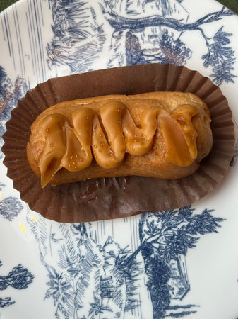 close up of an eclair with caramelized condensed milk on top