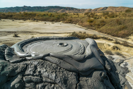 Active mud volcanoes park captured in Romaniaの写真素材
