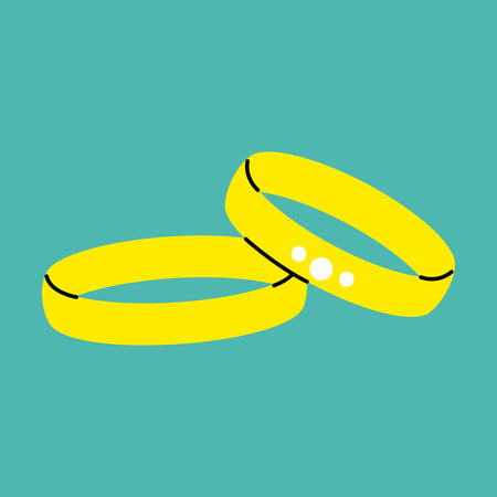 Two simple gold wedding bands with a single diamond on the top band.