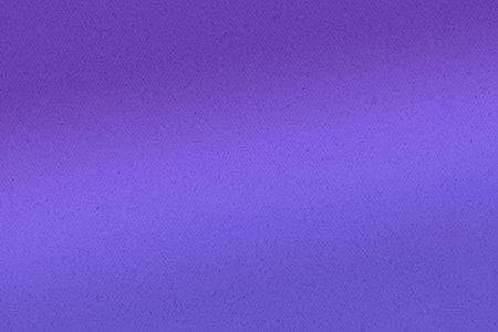 A close-up of a textured, purple paper surface.