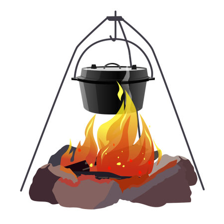 Cooking over an open fire using a pot suspended on a tripod standの写真素材