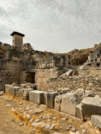 Ancient stone ruins in daylight reveal history at a historical site in a mountainous regionの写真素材