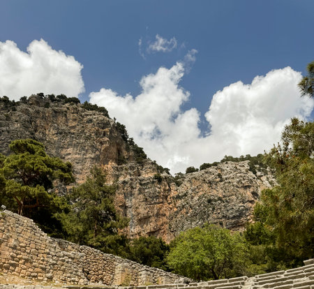 Exploring ancient ruins with a stunning mountain backdrop during the day