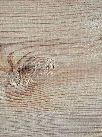 Close-up of wood grain featuring unique knots, textures, and colorsの写真素材