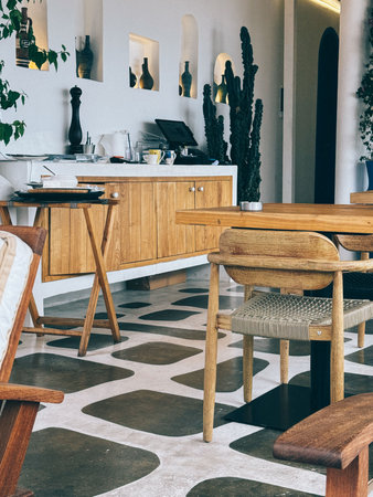 Interior view of a modern cafe with minimalistic design and natural elementsの写真素材