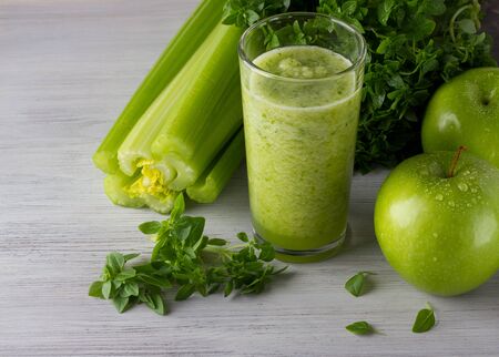Fresh green smoothie wtih apple, basil, celeryの写真素材