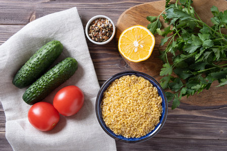 Ingredients for Tabouli Salad or Tabule, Tabbouleh - simple Mediterranean salad with vegetables and bulgur.の写真素材