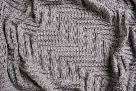 Geometric light grey knitted wool background textureの写真素材