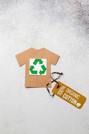 Organic cotton clothing concept with label. Paper craft t-shirt. Eco-clothingの写真素材