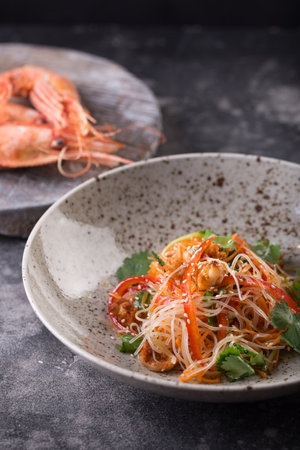 Funchose salad with shrimps and vegetables with sesame seeds. Photo for menuの写真素材