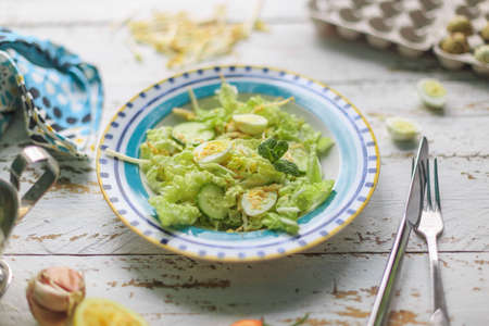 Healthy salad with quail eggs and cucumbersの写真素材