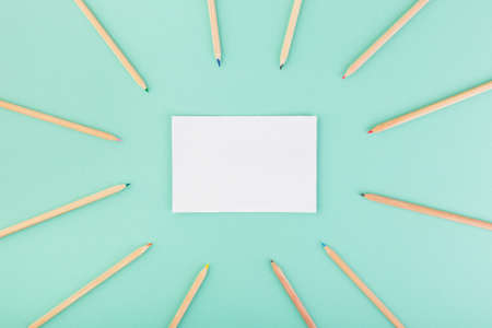 Coloured pencils around white paper. Drawing concept. New hobby.の写真素材