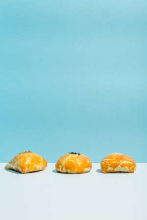 Small fried pies with meat samsa on blue background
