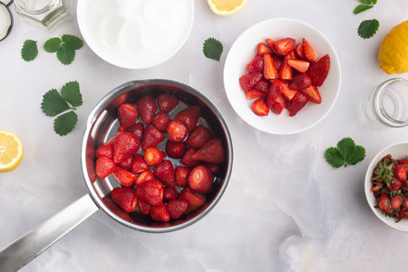 Jam strawberries preparation process. Season canning berries and cooking homemade jam conceptの写真素材