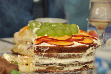 Birthday cake with peach slices and grapes