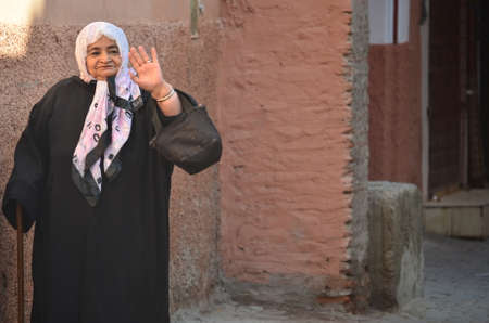 Marrakech, Morocco November 19, 2012. Woman with djellaba in the city of Marrakech.のeditorial素材
