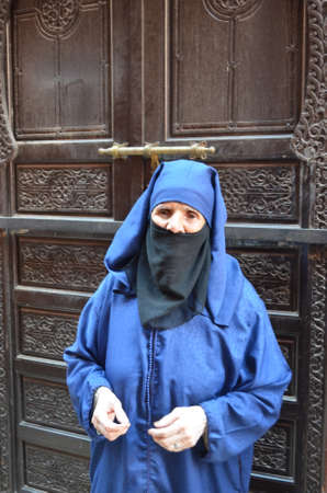 Marrakech, Morocco.November 22, 2012 Woman with djellaba in the city of Marrakech.のeditorial素材