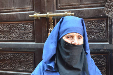 Marrakech, Morocco.November 22, 2012 Woman with djellaba in the city of Marrakech.のeditorial素材