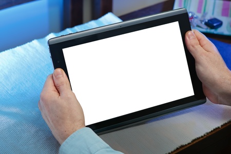 hands holding tablet-pc with the white screen and a background of blue lights