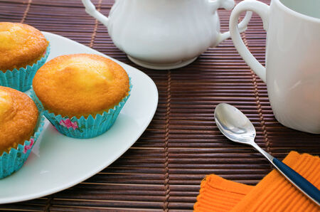 various muffins on a plate with tea setの写真素材