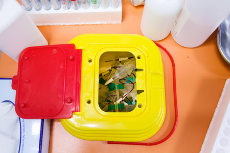 workbench with Medical waste container with useful laboratory for analysis blood