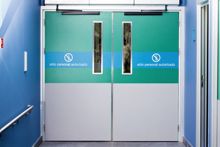 gateway to hospital emergency  across the silhouette of a doctor walkingの写真素材