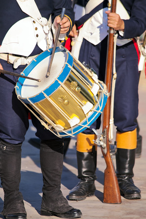Military drummer and soldier armed with musket の写真素材