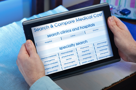 man searching web internet for recruitment health insurance on internet with tablet in you home  hands of a man consulting a website of online health service in the tabletの写真素材