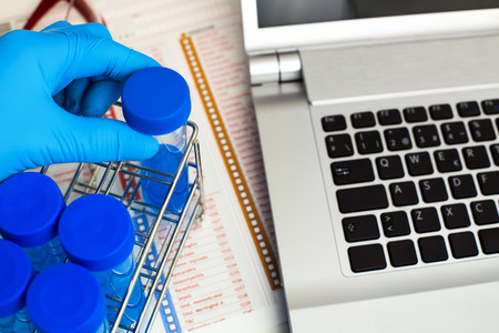 Chemist with pcr tube in the chemical lab / researcher holding tube test for analysis and work table of laboratoryの写真素材