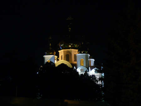 Kind of a Christian cathedral at night in rays of lightの写真素材