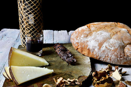 cheese board with blood sausage and typical spanish wine