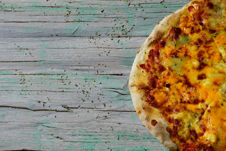 delicious pizza served on wooden tableの写真素材