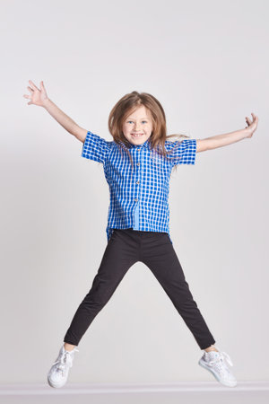 Russia Ekaterinburg - April 1, 2017: Girl child having fun and posing in Studio on a white background, the smile on her face. Bright positive emotionsのeditorial素材