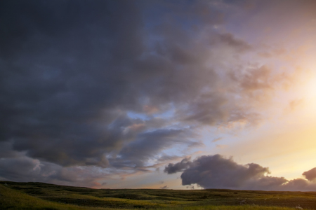 Sunset in the steppe, a beautiful evening sky with clouds, plato Ukok, no one around, Altai, Siberia, Russiaの写真素材