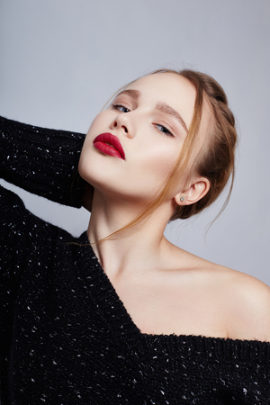 Blonde girl in blouse portrait bright makeup and lipstick closeup, facial cosmetics, professional makeup, skin care. Young sexy woman posing, sensual look and blue eyesの写真素材