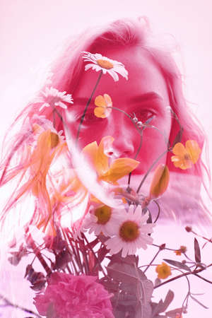 Woman with flowers inside, double exposure. Blonde girl in lingerie on crimson background, dreamy mysterious look. Wildflowers on a background of women with a double exposure on a light backgroundの写真素材