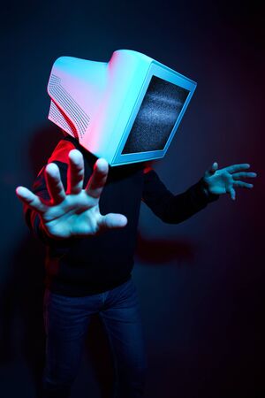 Man cyberpunk with a monitor instead of a head, computer addiction and zombie TV. Zombification, TV...