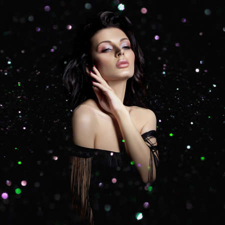 Portrait brunette hair woman with a chic lush wavy hair, plump lips, Bokeh glitter. Natural...