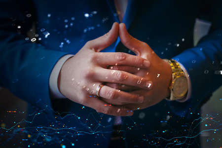 Man hands digital business graphics. Digital economy, trading on stock exchange, currency jumps. Confident pose businessmanの写真素材