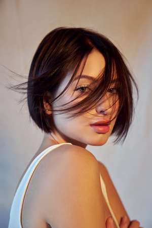 Portrait beauty woman short hair fashion coloring. Dark hair coloring, short haircut chocolate...